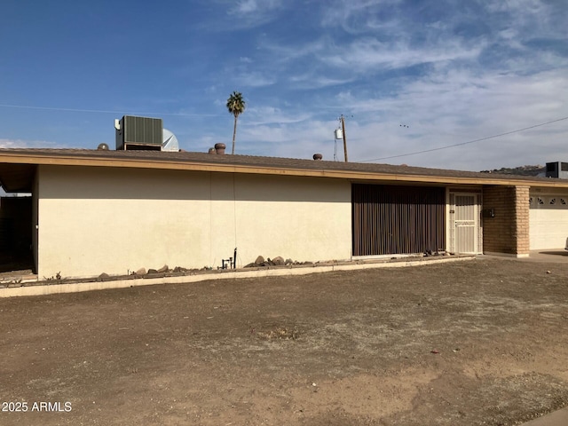 view of home's exterior with central air condition unit