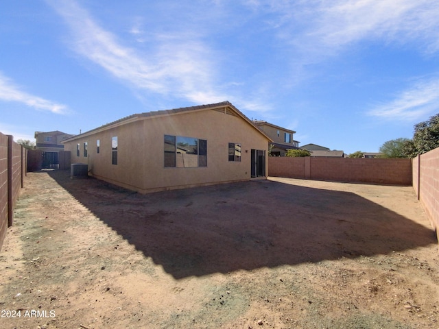 back of property featuring central AC unit