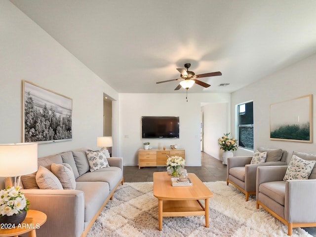 living room featuring tile patterned floors and ceiling fan