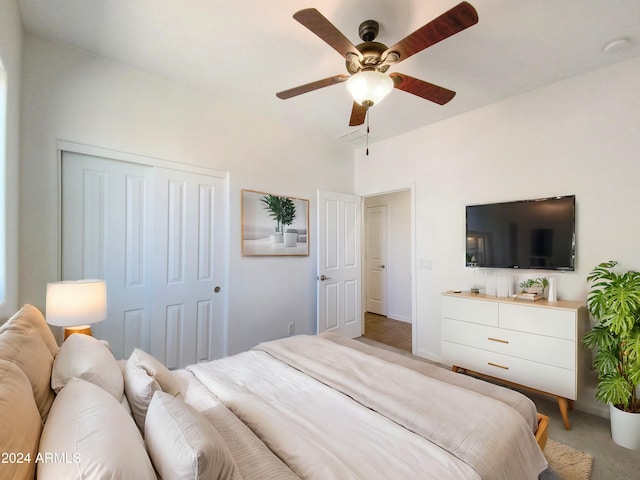 carpeted bedroom with a closet and ceiling fan