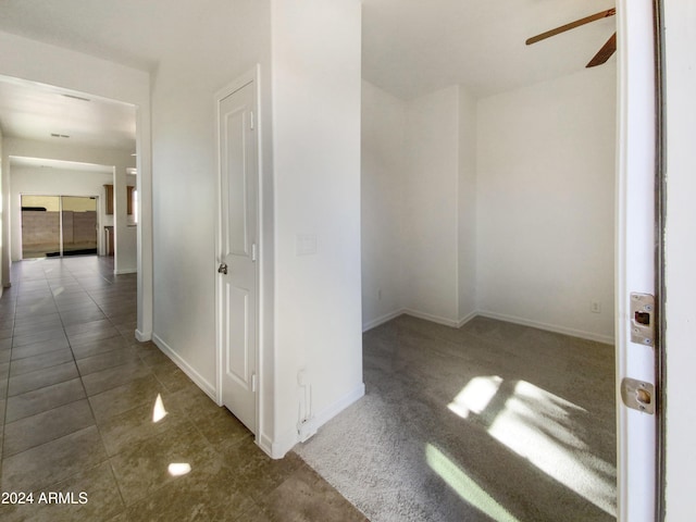 hallway featuring tile patterned flooring