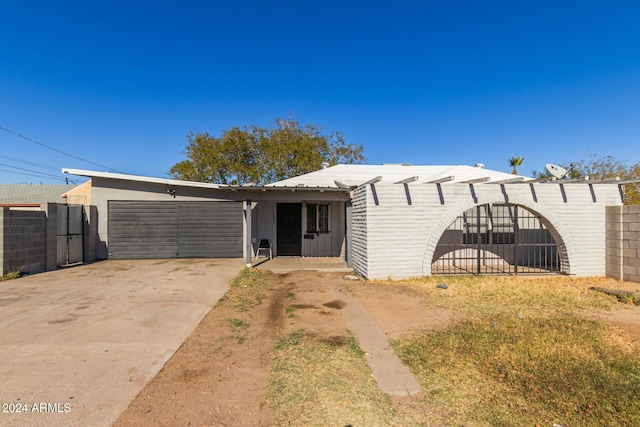 single story home featuring a garage