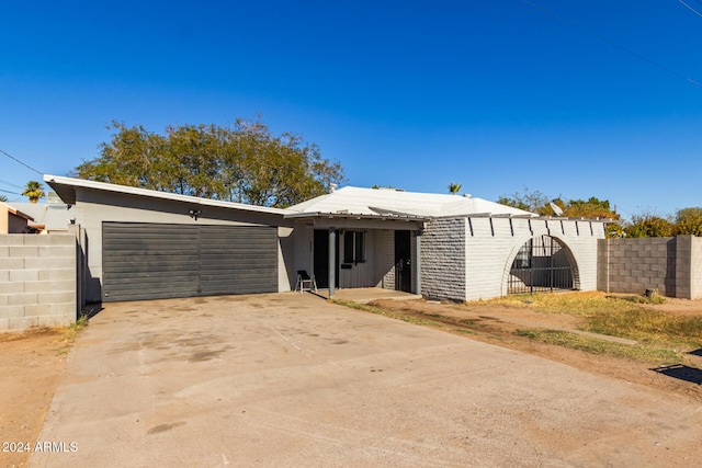 ranch-style house featuring a garage