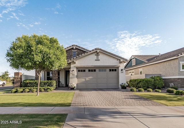 view of front facade featuring a garage and a front lawn