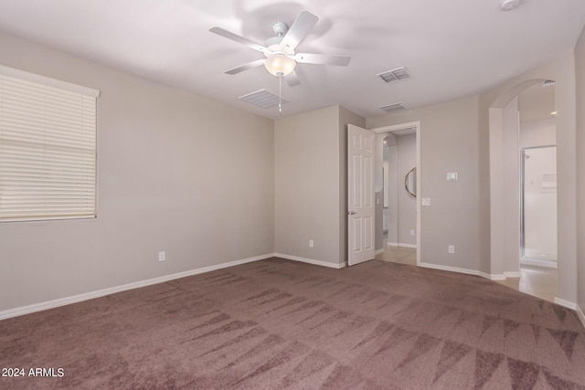 unfurnished bedroom featuring ceiling fan and carpet floors