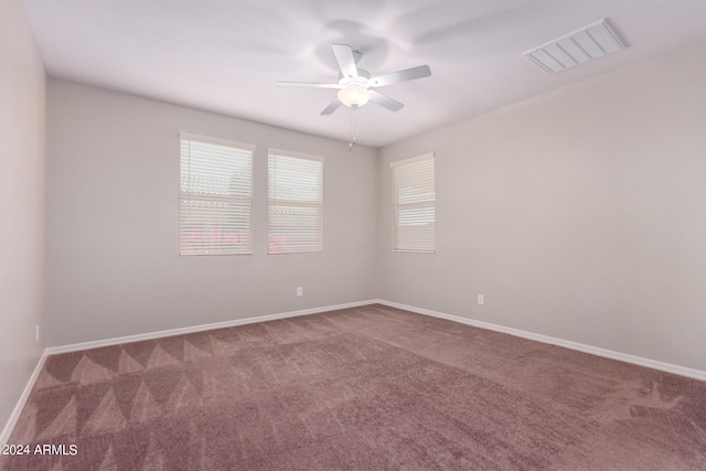 carpeted empty room with ceiling fan