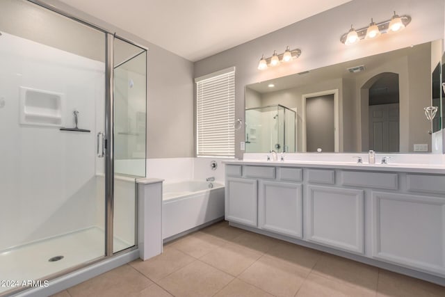 bathroom featuring tile patterned floors, separate shower and tub, and vanity