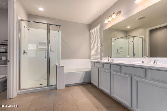 full bathroom featuring toilet, vanity, tile patterned flooring, and plus walk in shower