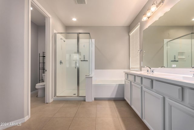 full bathroom featuring toilet, vanity, independent shower and bath, and tile patterned flooring