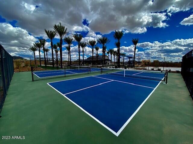 view of sport court featuring fence