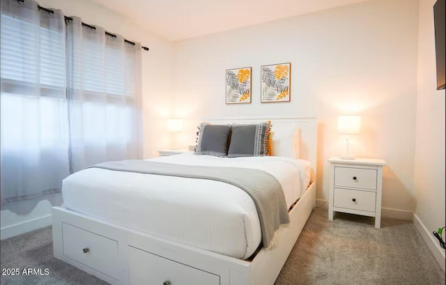 carpeted bedroom featuring baseboards