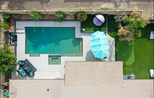 drone / aerial view of a pool