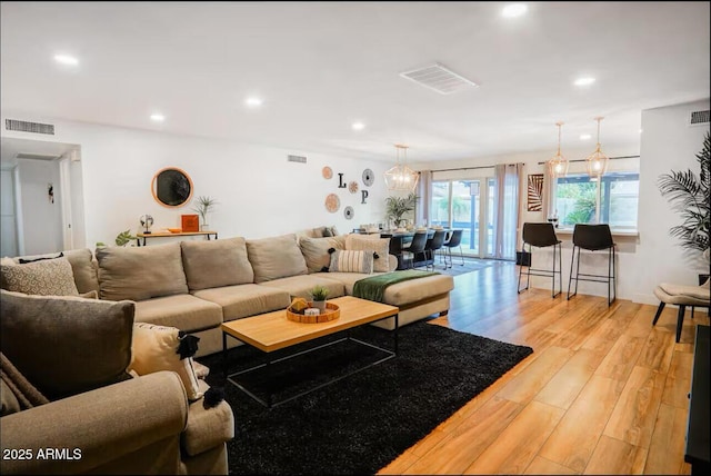 living room featuring light wood-style floors and recessed lighting