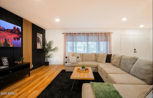 living area with wood finished floors and recessed lighting