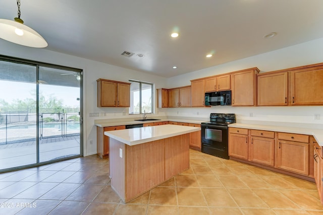 7398 W Paso Trl, Peoria, AZ 85383 - kitchen featuring black appliances, light countertops, light tile patterned floors, a center island, and recessed lighting