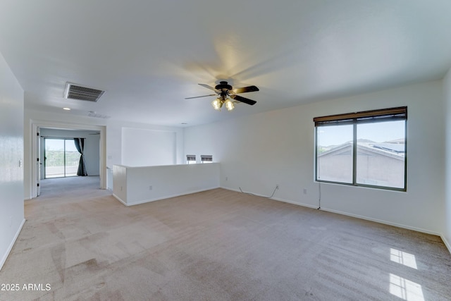 7398 W Paso Trl, Peoria, AZ 85383 - spare room featuring light colored carpet and a ceiling fan