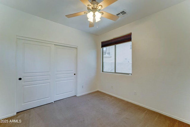 7398 W Paso Trl, Peoria, AZ 85383 - unfurnished bedroom featuring carpet, a closet, and a ceiling fan