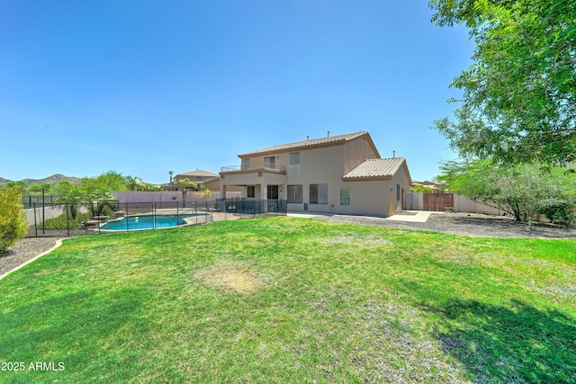 7398 W Paso Trl, Peoria, AZ 85383 - rear view of property with a fenced backyard, stucco siding, and a tiled roof