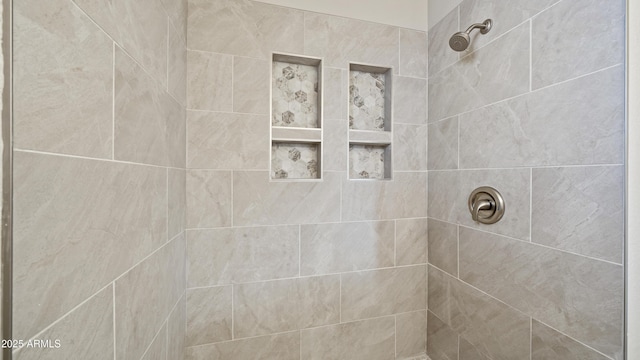 full bathroom with a tile shower