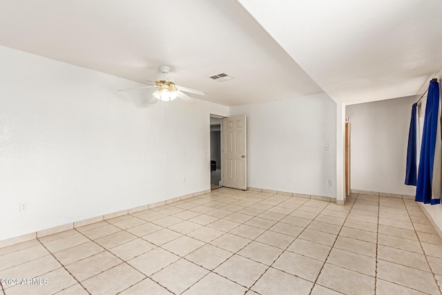 spare room with light tile patterned floors, ceiling fan, and visible vents