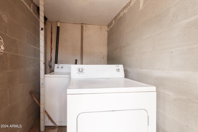 laundry room featuring washing machine and dryer and laundry area