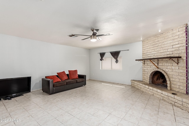 tiled living room with ceiling fan, a fireplace, and brick wall