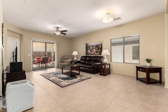 tiled living room featuring ceiling fan