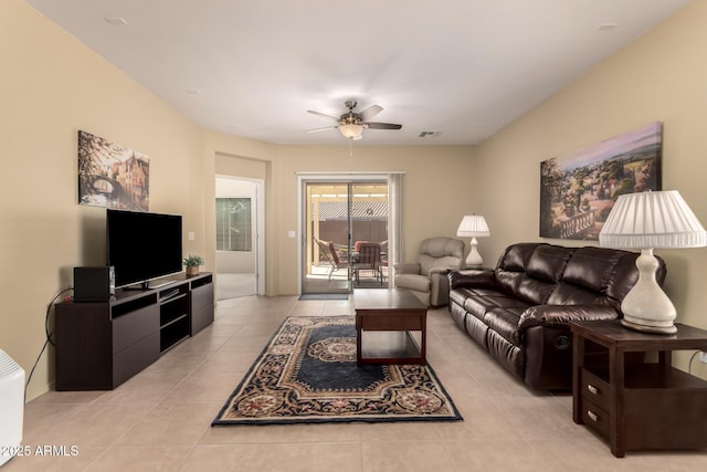 living room with light tile patterned floors and ceiling fan