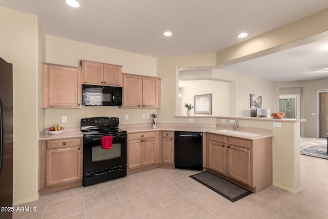 kitchen with light tile patterned flooring, sink, light brown cabinets, kitchen peninsula, and black appliances