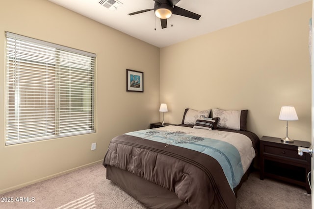 bedroom featuring light carpet and ceiling fan