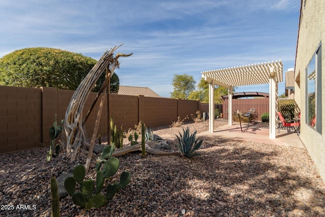 view of yard with a pergola and a patio area