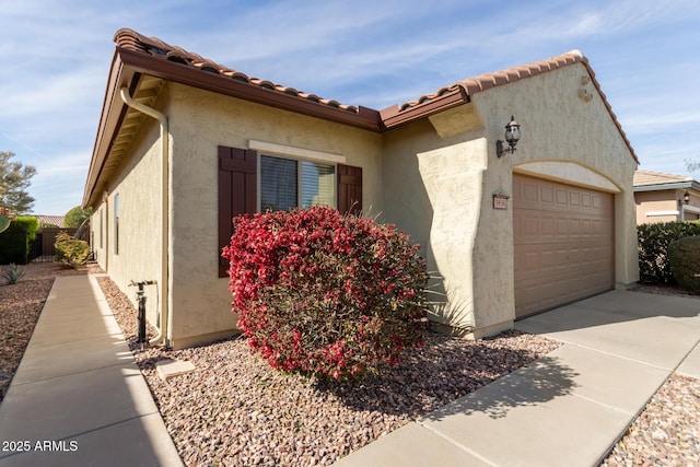 view of property exterior featuring a garage