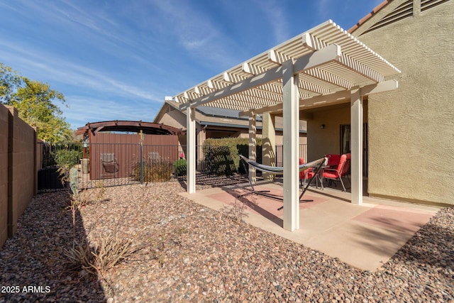 view of yard with a pergola, a patio, and a gazebo