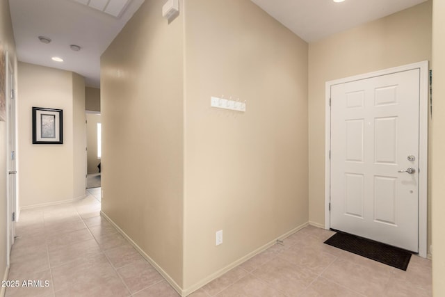 corridor featuring light tile patterned flooring