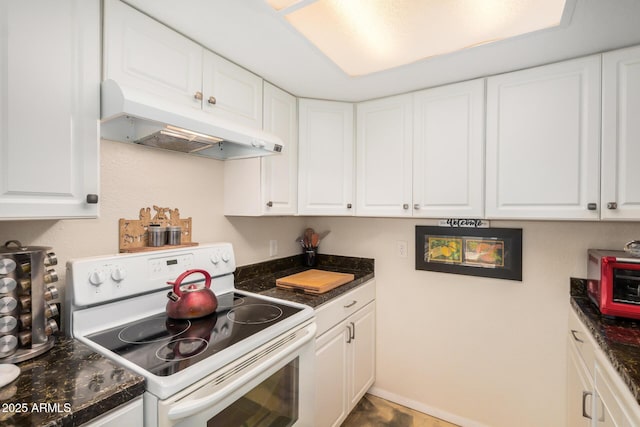 1916 W Morningside Dr Unit 108, Phoenix, AZ 85023 - kitchen with white electric stove, under cabinet range hood, white cabinets, and dark countertops
