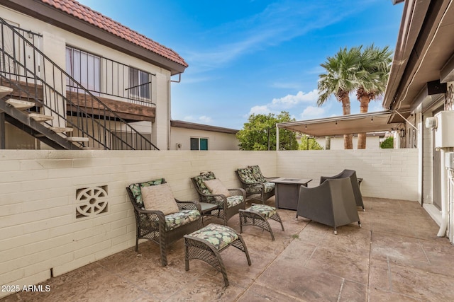 1916 W Morningside Dr Unit 108, Phoenix, AZ 85023 - view of patio featuring a fenced backyard, an outdoor living space with a fire pit, and stairs