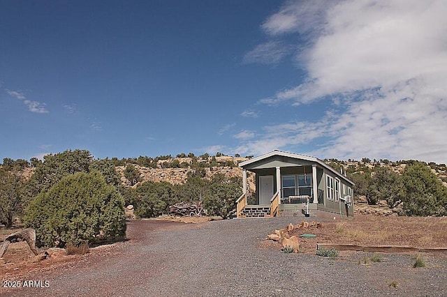 manufactured / mobile home featuring covered porch