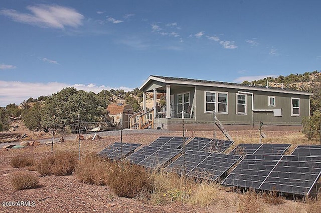 back of property with solar panels