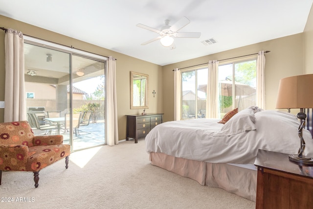 bedroom featuring light carpet, access to outside, and ceiling fan