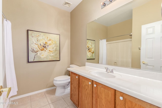 bathroom with vanity, a shower with curtain, toilet, and tile patterned flooring