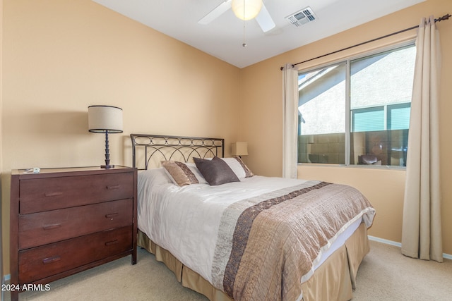 bedroom featuring ceiling fan and light colored carpet