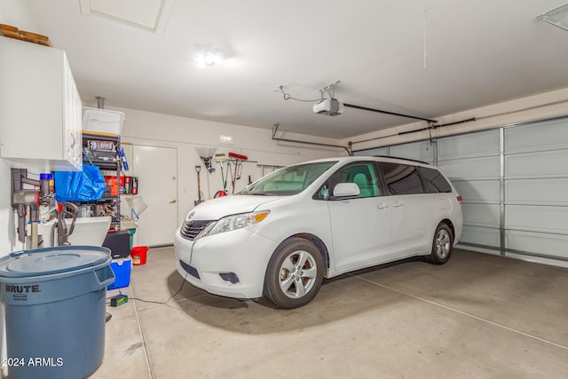 garage featuring a garage door opener