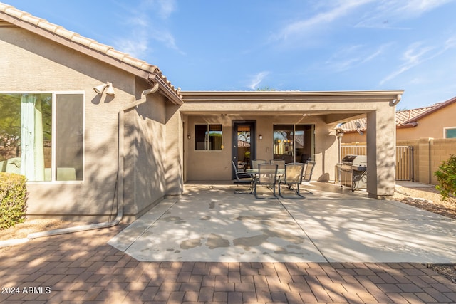 rear view of property with a patio area