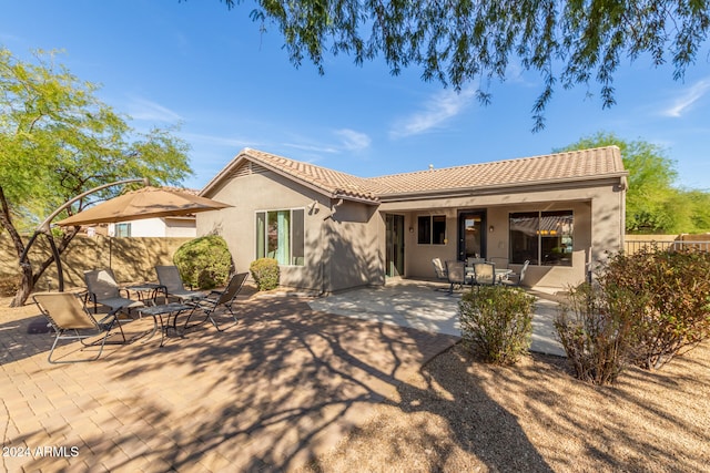 rear view of house featuring a patio area