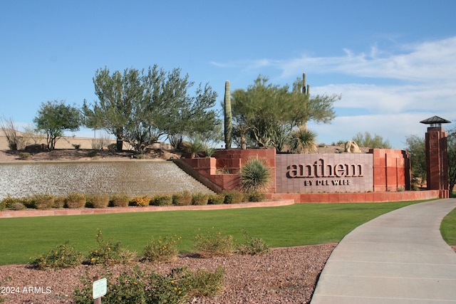 community sign featuring a lawn