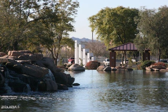 property view of water with a gazebo