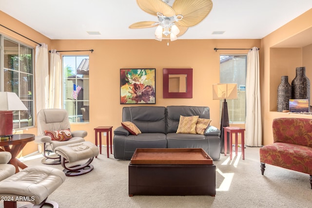 living room featuring carpet flooring and ceiling fan