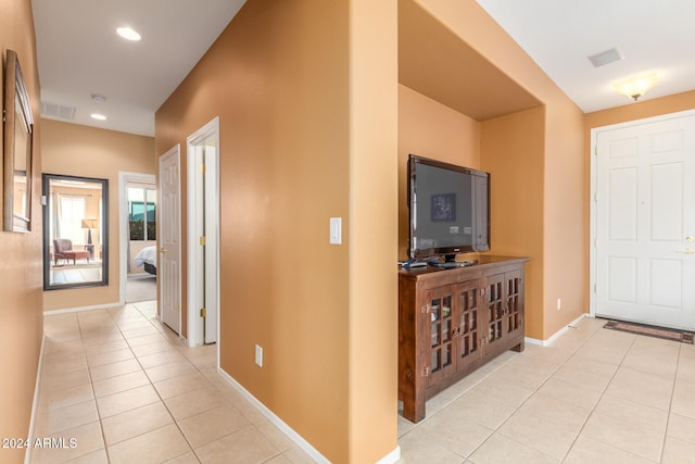 hallway with light tile patterned floors