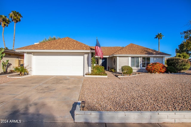 ranch-style home with a garage