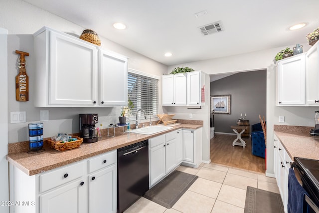 kitchen featuring black appliances, white cabinets, light tile patterned floors, and sink